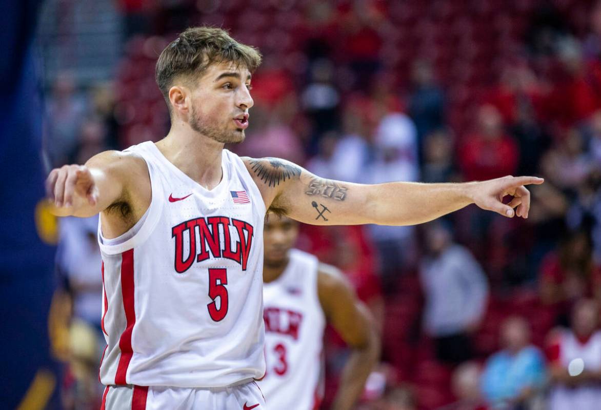 UNLV Rebels guard Jordan McCabe (5) directs his teammates after a foul for critical free throws ...