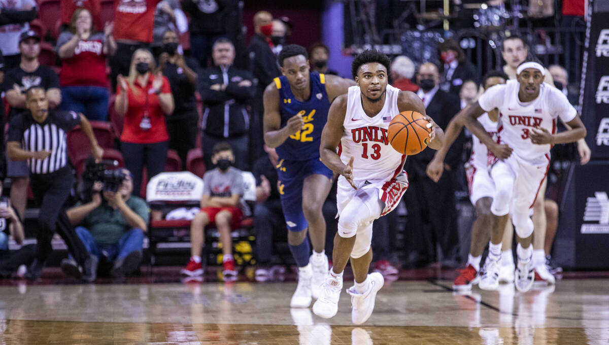 UNLV Rebels guard Bryce Hamilton (13) looks to put the games away after scooping up a loose bal ...