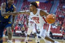 UNLV Rebels guard Bryce Hamilton (13) drives the lane against California Golden Bears guard Jal ...