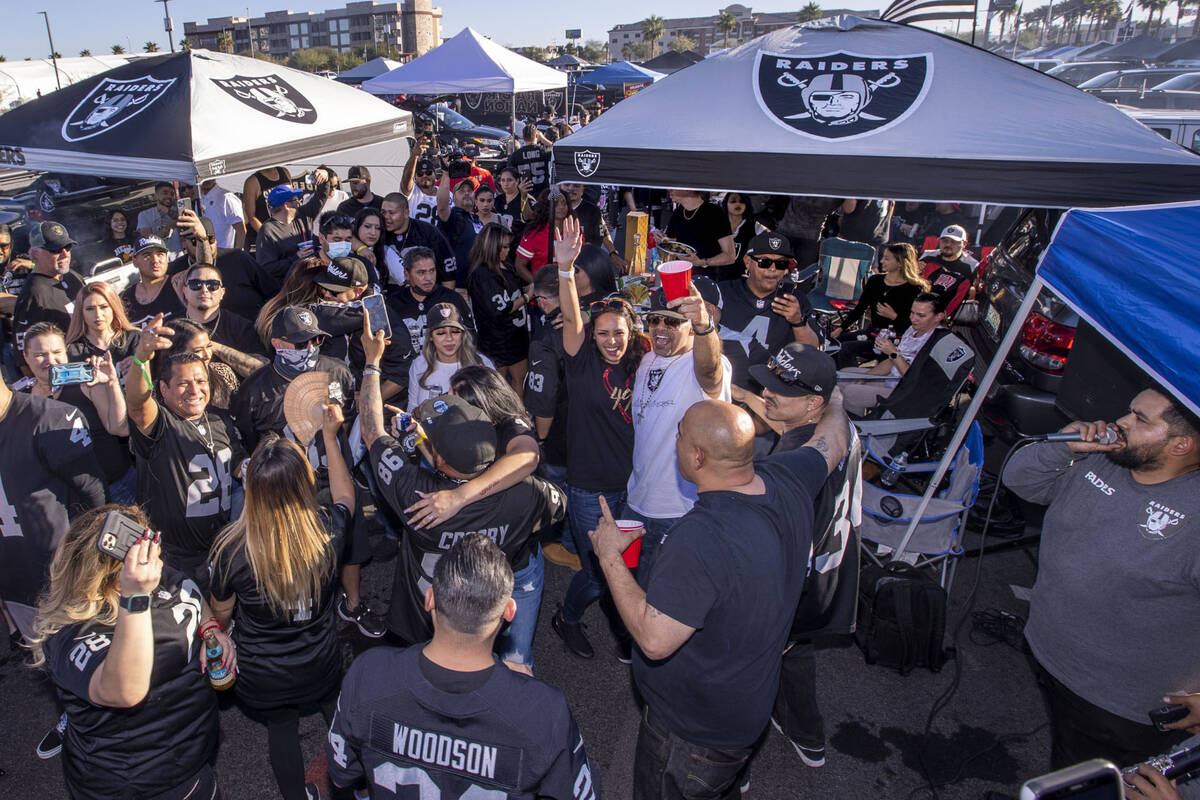 Raiders fans dance to live Mexican music in tailgating before an NFL game versus the Kansas Cit ...