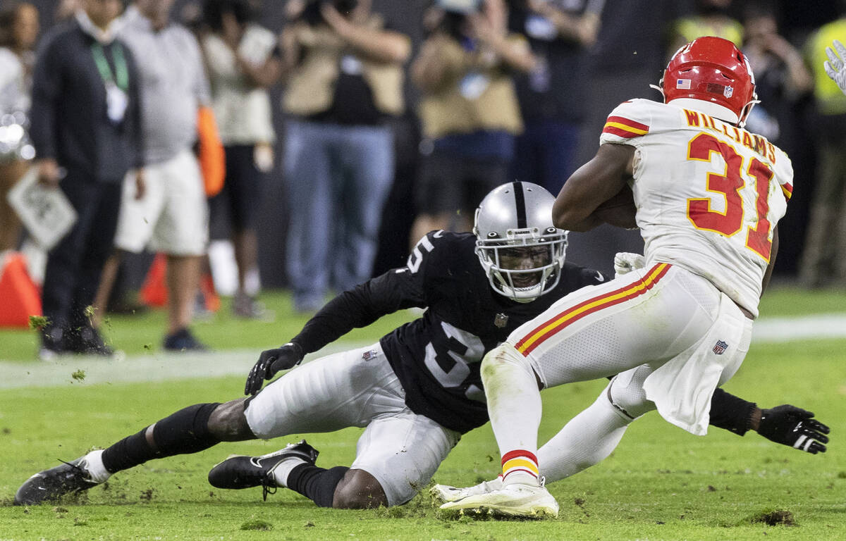 Raiders defensive back Brandon Facyson (35) tackles Kansas City Chiefs running back Darrel Will ...