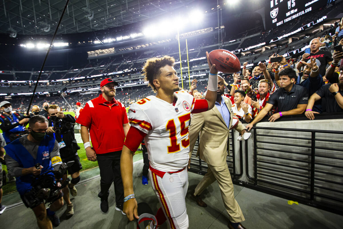 Kansas City Chiefs quarterback Patrick Mahomes (15) celebrates after defeating the Raiders 41-1 ...