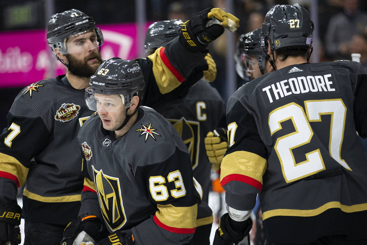 Golden Knights right wing Evgenii Dadonov (63) leaves the huddle after scoring a goal during th ...