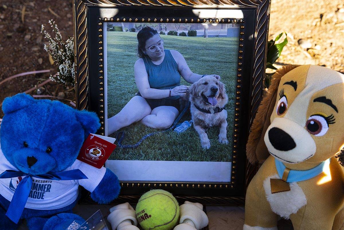 A photograph of Tina Tintor, 23, and her dog is placed at a makeshift memorial site to honor th ...