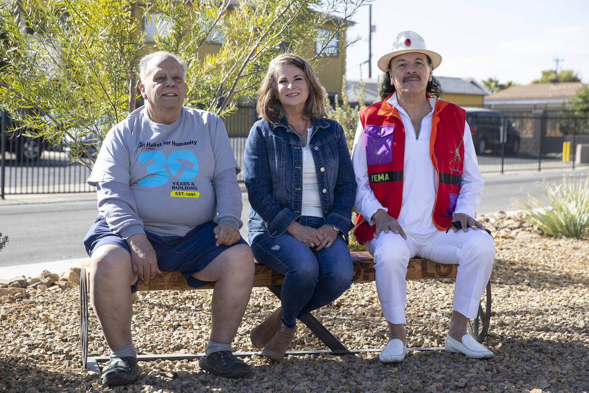 Reuben Nieves, from left, with Henderson Mayor Debra March musician Carlos Santana, pose during ...