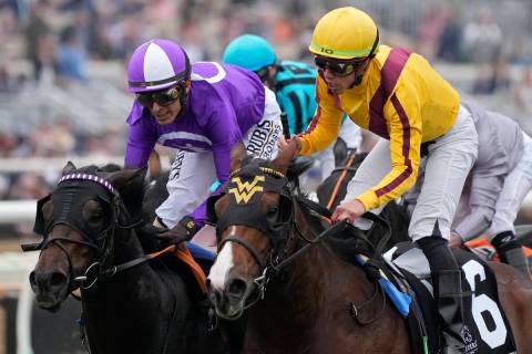 Irad Ortiz Jr., right, rides Twilight Gleaming to win the Breeders' Cup Juvenile Turf Sprint ra ...
