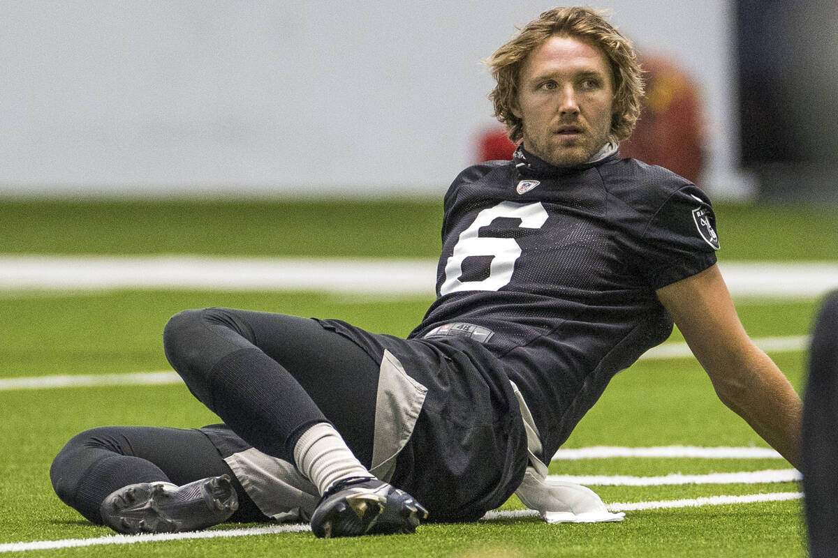 Las Vegas Raiders punter AJ Cole (6) stretches with teammates during warm ups at the Intermount ...