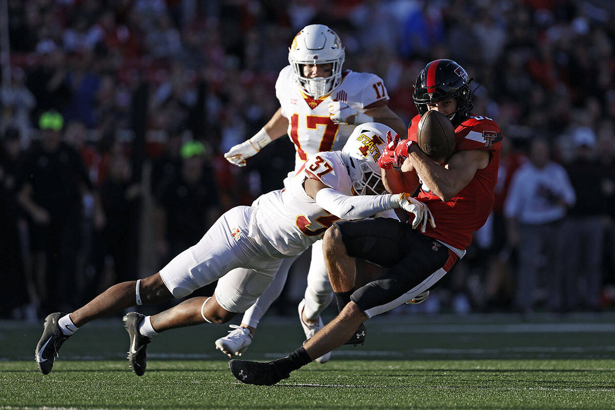 Iowa State's Jordyn Morgan (37) tackles Texas Tech's Dalton Rigdon (86) during the second half ...