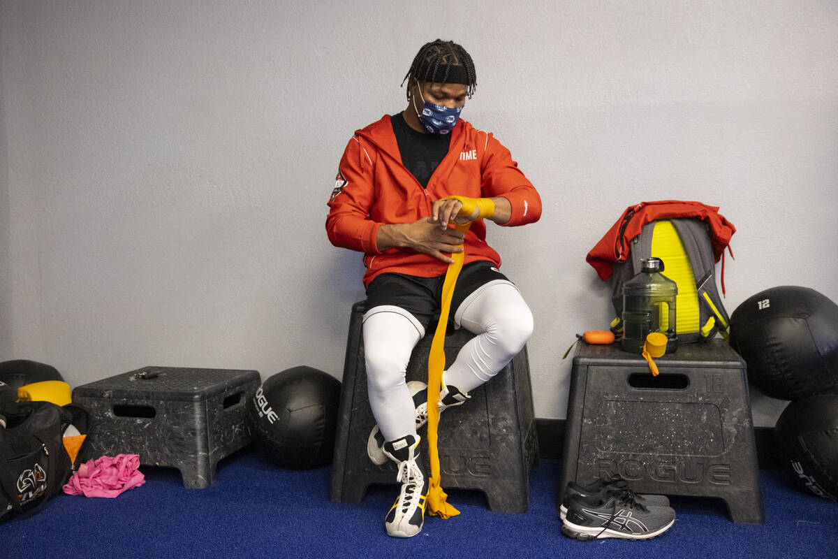 Shawn Porter wraps his hands for a workout in preparation for an upcoming fight, at the Real Bo ...