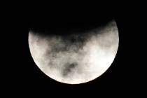 A partial lunar eclipse is seen in Manila, Philippines on Friday, Nov. 19, 2021. (AP Photo/Aaro ...