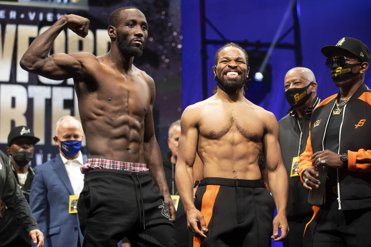 Terence Crawford, left, and Shawn Porter, pose during a weigh-in event at the Mandalay Bay hote ...