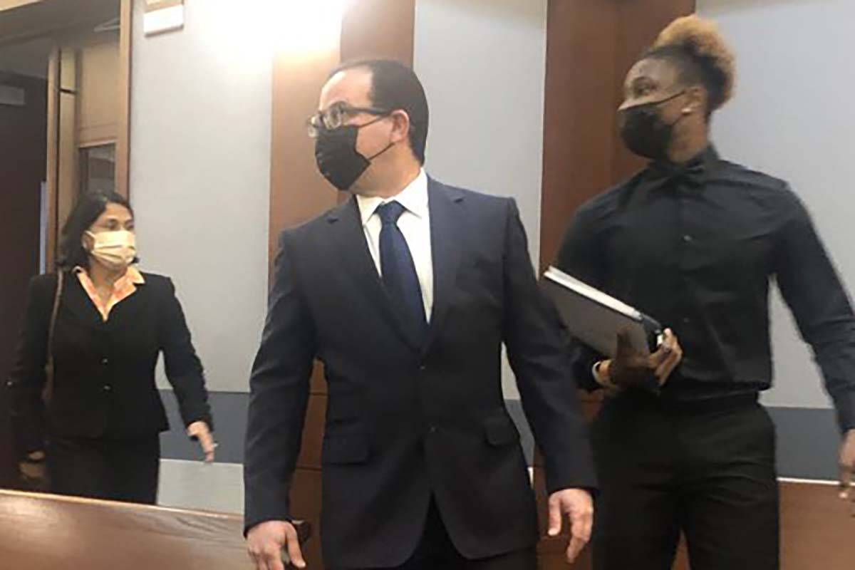 Former Raiders wide receiver Henry Ruggs, right, makes his way into the courtroom on Monday, No ...