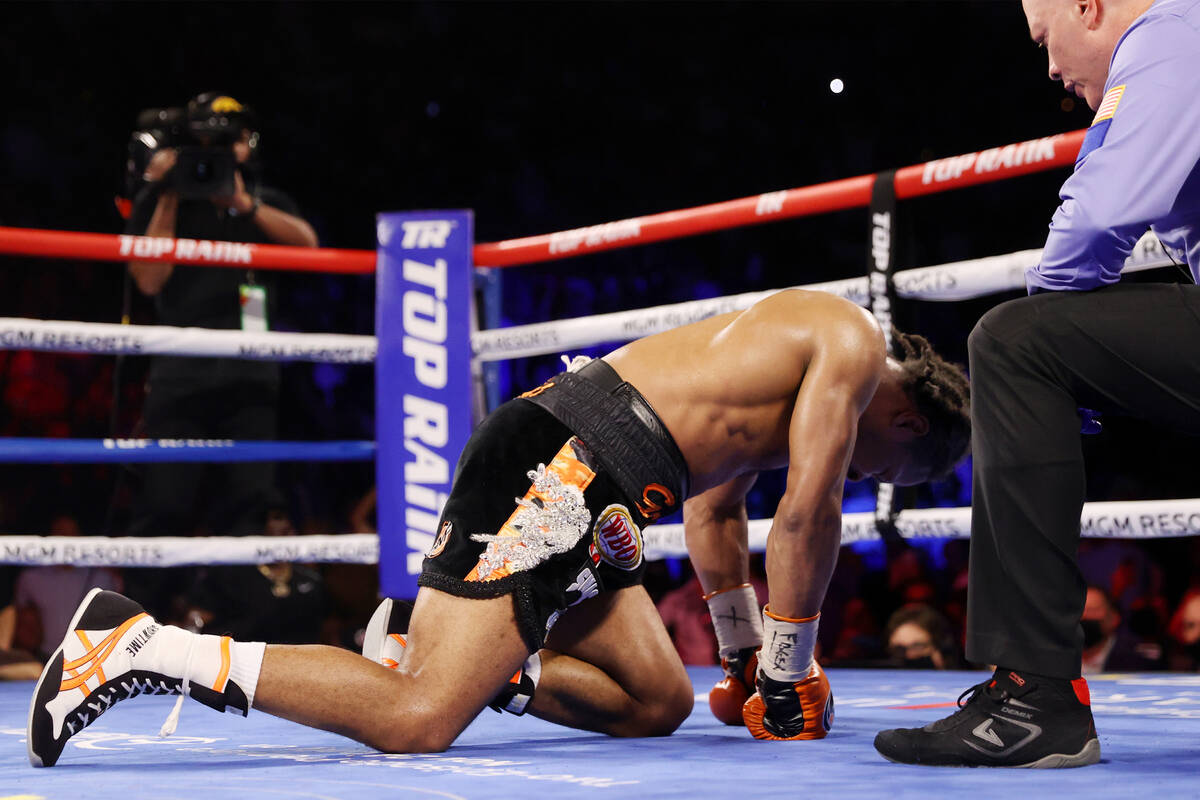 Shawn Porter gets a count after getting knocked down by Terence Crawford in the 10th round of t ...