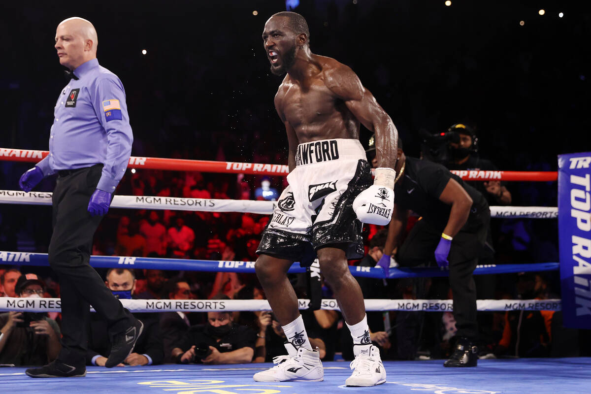 Terence Crawford reacts after his technical knockout win against Shawn Porter in the 10th round ...