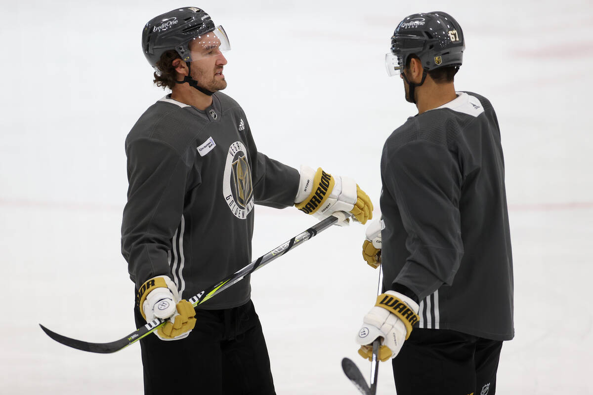 Vegas Golden Knights right wing Mark Stone (61) and left wing Max Pacioretty (67) talk during a ...