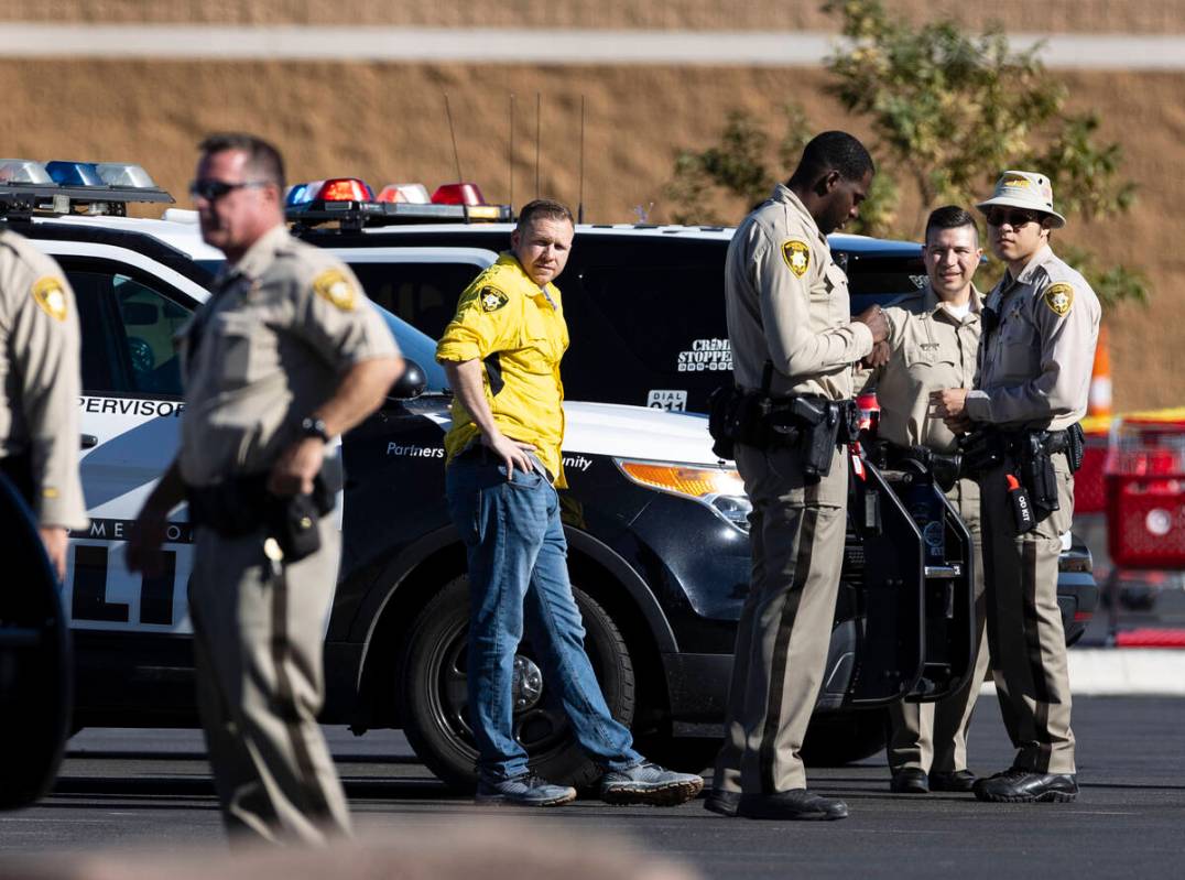 Las Vegas police officers investigate an officer-involved shooting at 3200 Tenaya Way, on Wedne ...