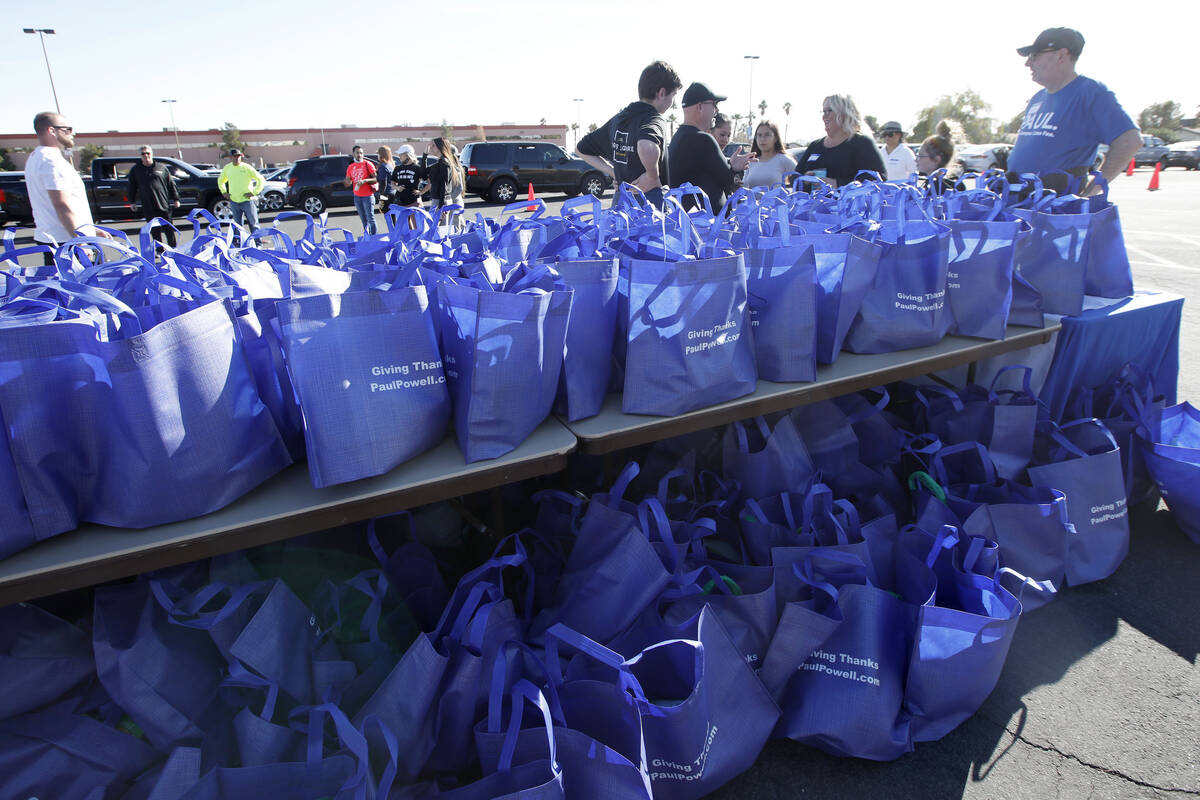 Bags of turkeys are lined up during Paul Powell's annual Thanksgiving Turkey Giveaway at Bill a ...