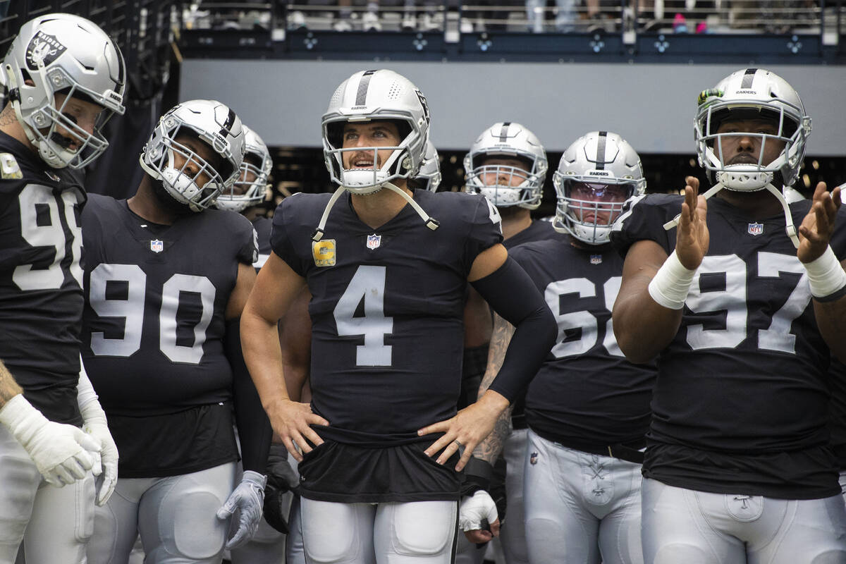 Raiders quarterback Derek Carr (4) waits to lead his team onto the field before the start of an ...