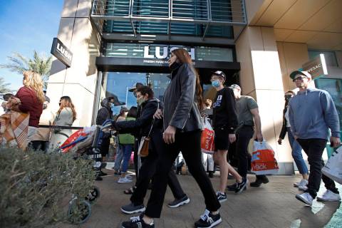 Black Friday shoppers walk through Downtown Summerlin, Friday, Nov. 26, 2021, in Las Vegas. (Ch ...