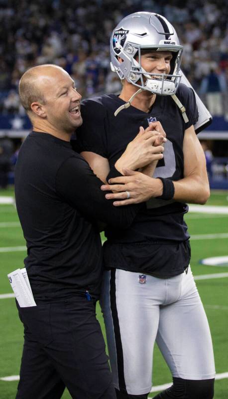 Raiders kicker Daniel Carlson (2) celebrates with Raiders coaching staff after making the winni ...