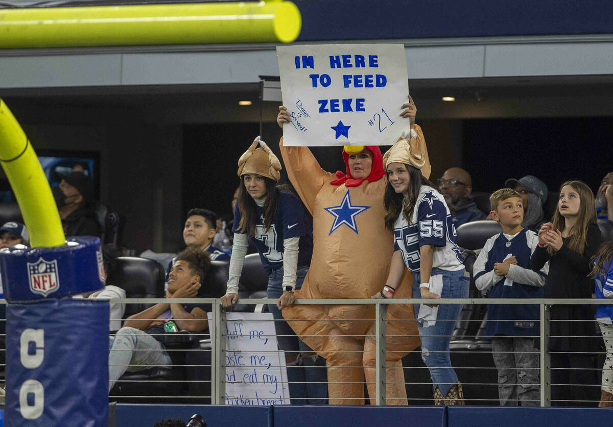 A Dallas Cowboys fan holds up a sign during the first quarter of an NFL football game against t ...