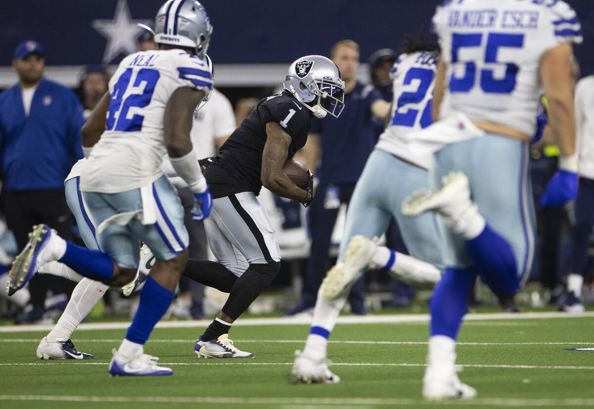 Raiders wide receiver DeSean Jackson (1) breaks off a big run past Dallas Cowboys middle lineba ...
