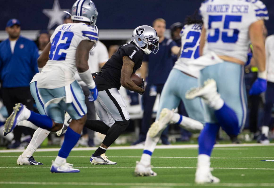 Raiders wide receiver DeSean Jackson (1) breaks off a big run past Dallas Cowboys middle lineba ...