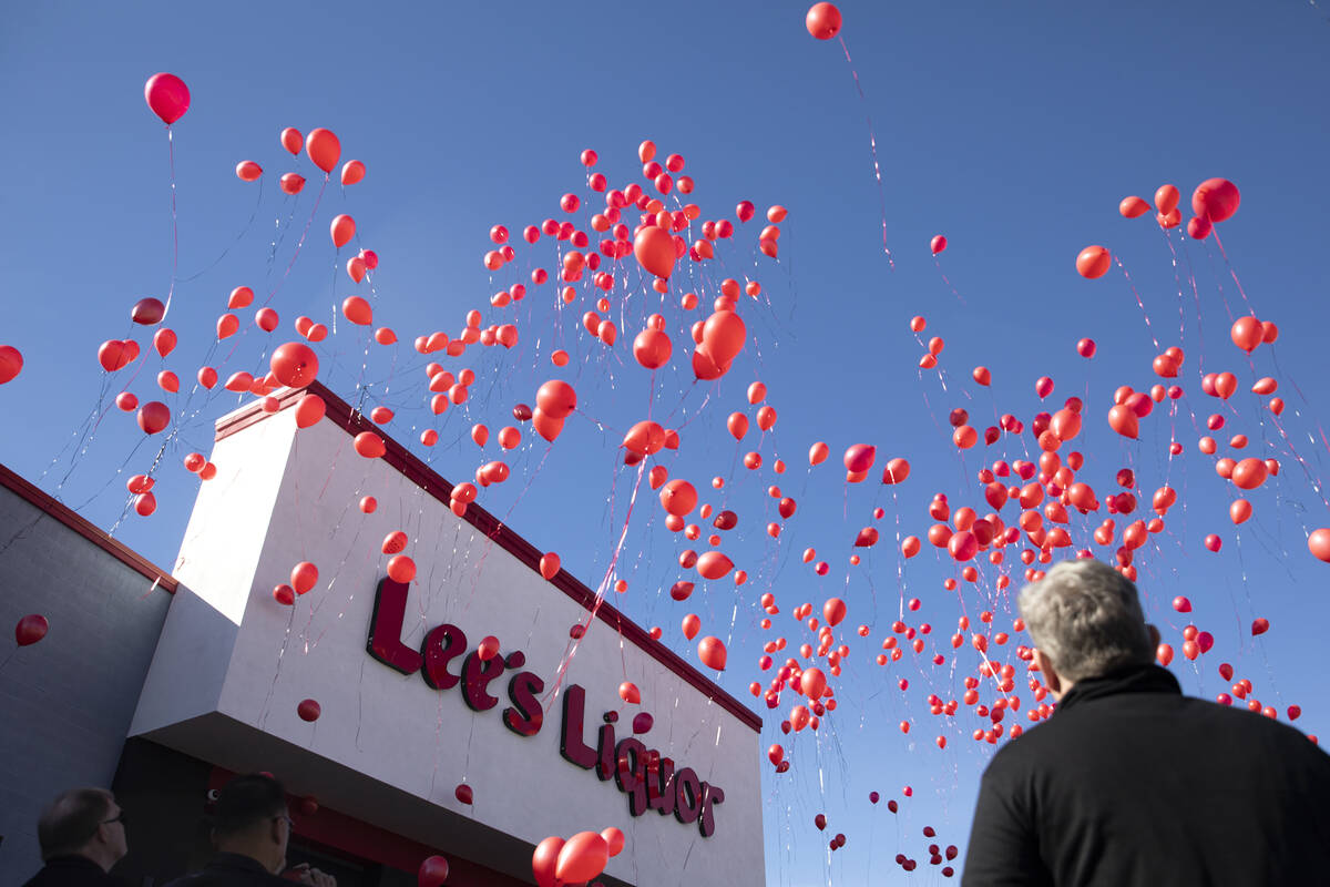 Biodegradable balloons are released during a vigil to the late Kenny Lee, the heir to Lee's Dis ...