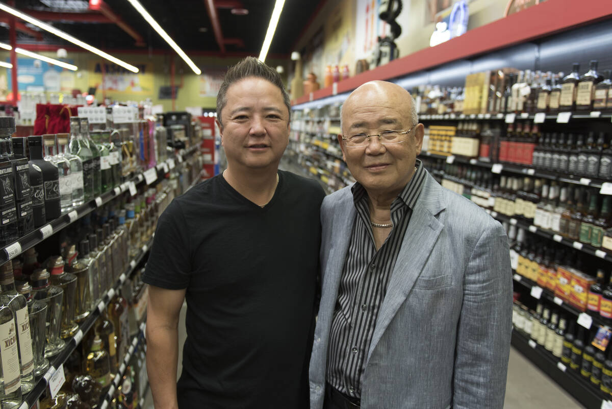 Hae Un Lee, founder of Lee's Discount Liquor, right, and his son, Kenny Lee, president of the c ...