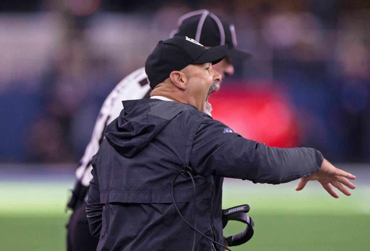 Raiders interim head coach Rich Bisaccia calls a play in the first half during an NFL football ...