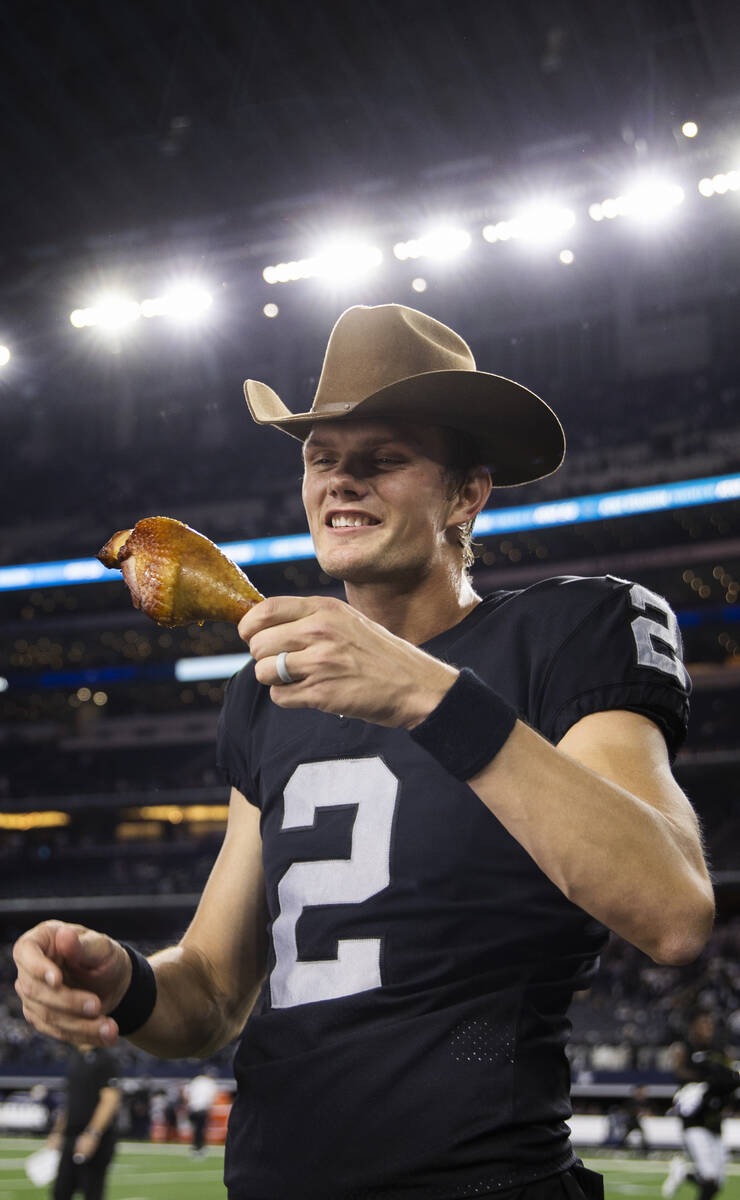 Raiders kicker Daniel Carlson (2) celebrates by eating a turkey leg after making the winning fi ...