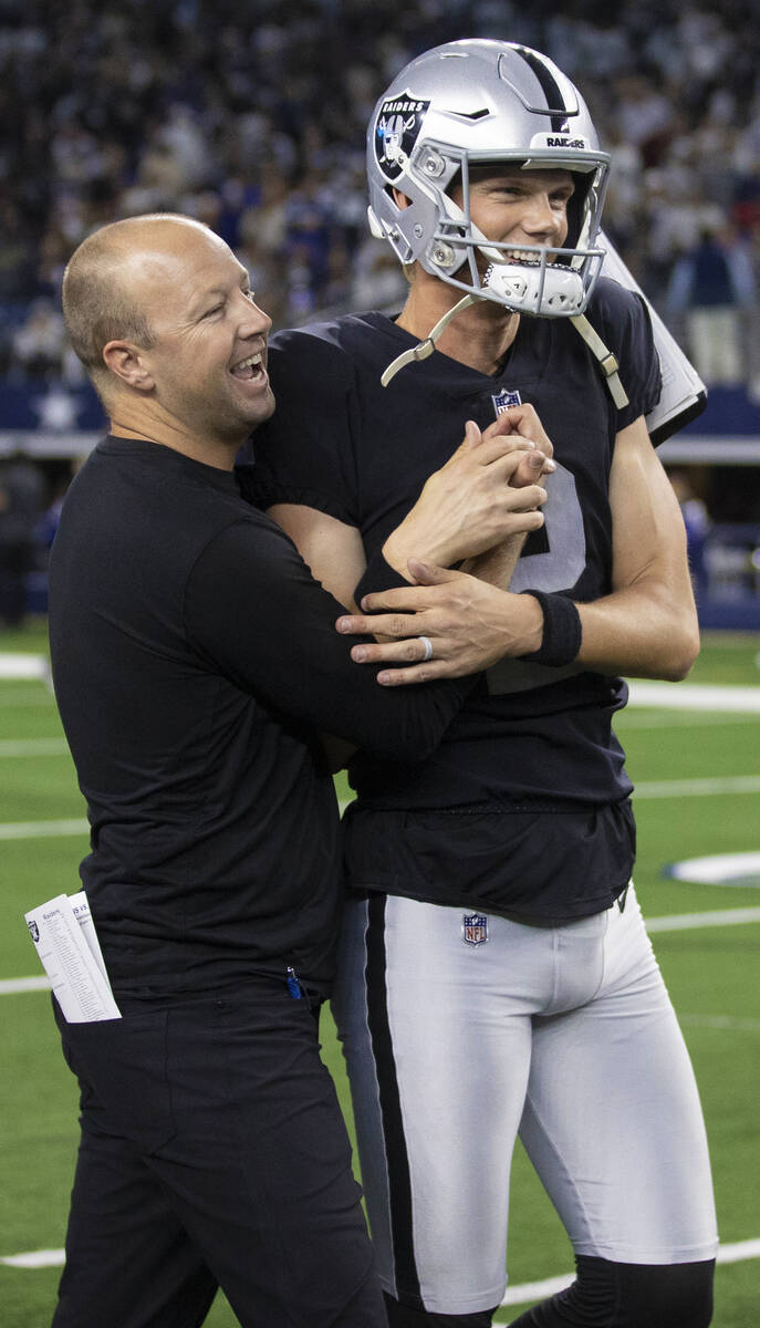 Raiders kicker Daniel Carlson (2) celebrates with Raiders coaching staff after making the winni ...
