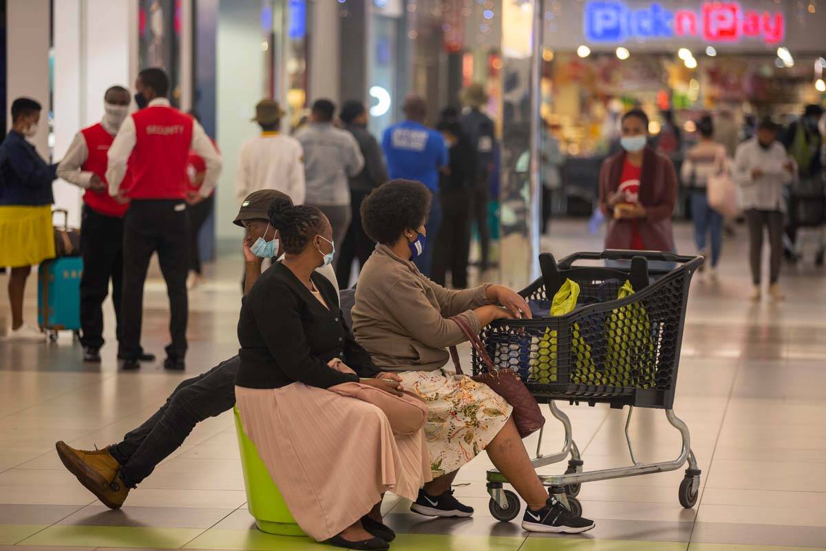 People shop in a mall, in Johannesburg, South Africa, Friday Nov. 26, 2021. Advisers to the Wor ...