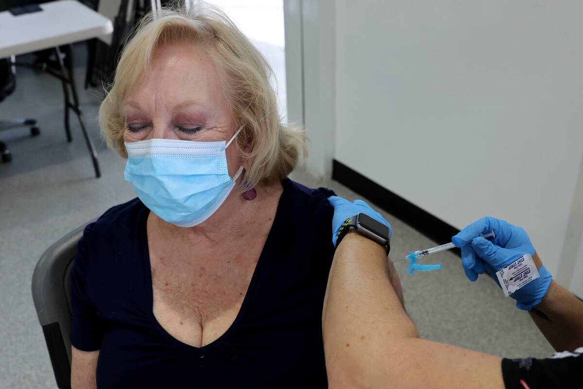 Algene Evans Wucinich of Las Vegas gets a Pfizer COVID-19 vaccine booster shot at the Southern ...