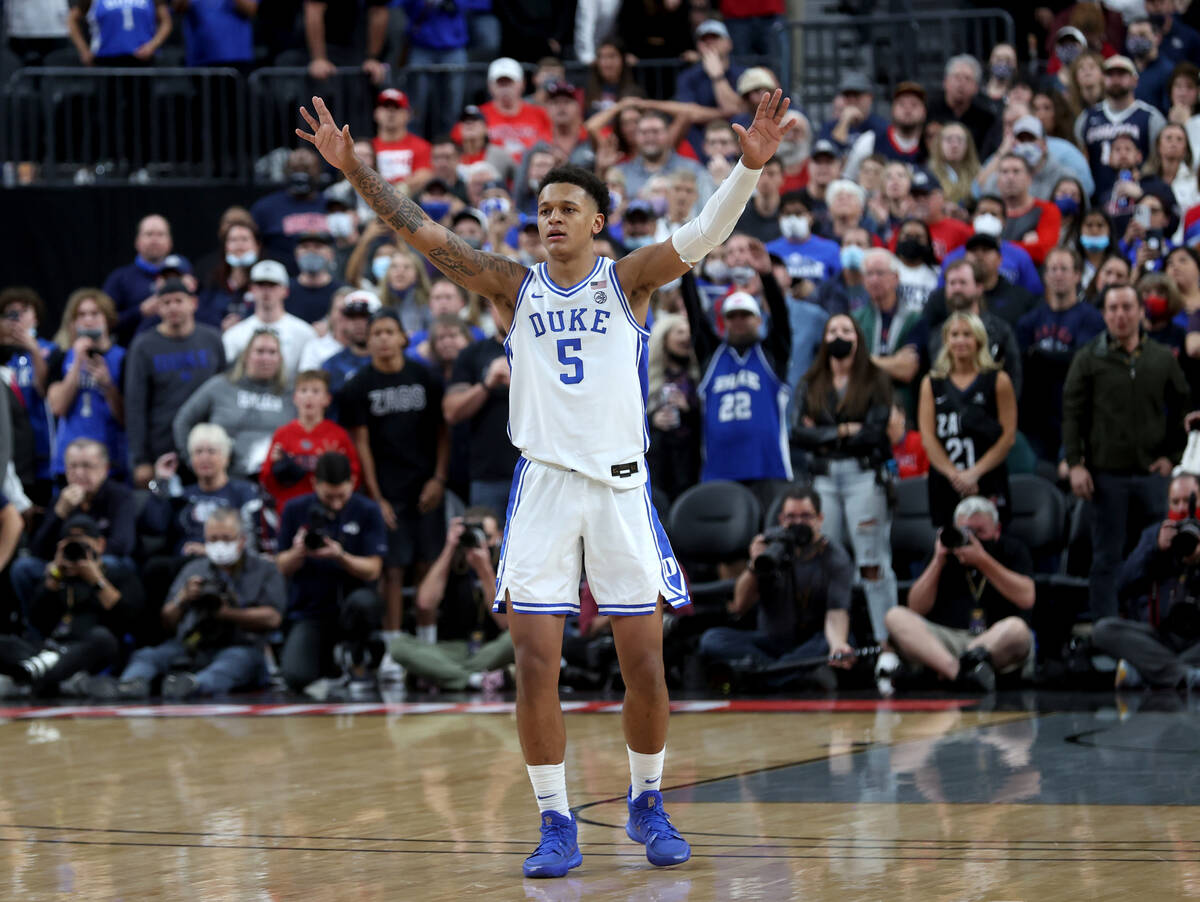 Duke Blue Devils forward Paolo Banchero (5) celebrates in the final seconds of an NCAA college ...