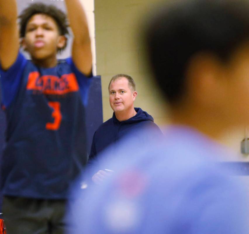 Bishop Gorman basketball head coach Grant Rice, center, watches a basketball practice at Bishop ...