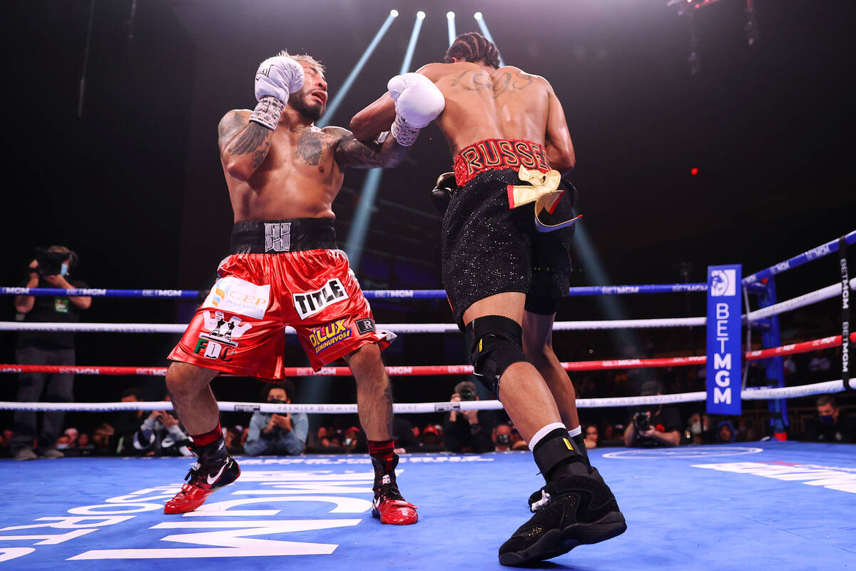 Gary Antonio Russell, right, connects a punch against Alexandro Santiago in the ninth round of ...