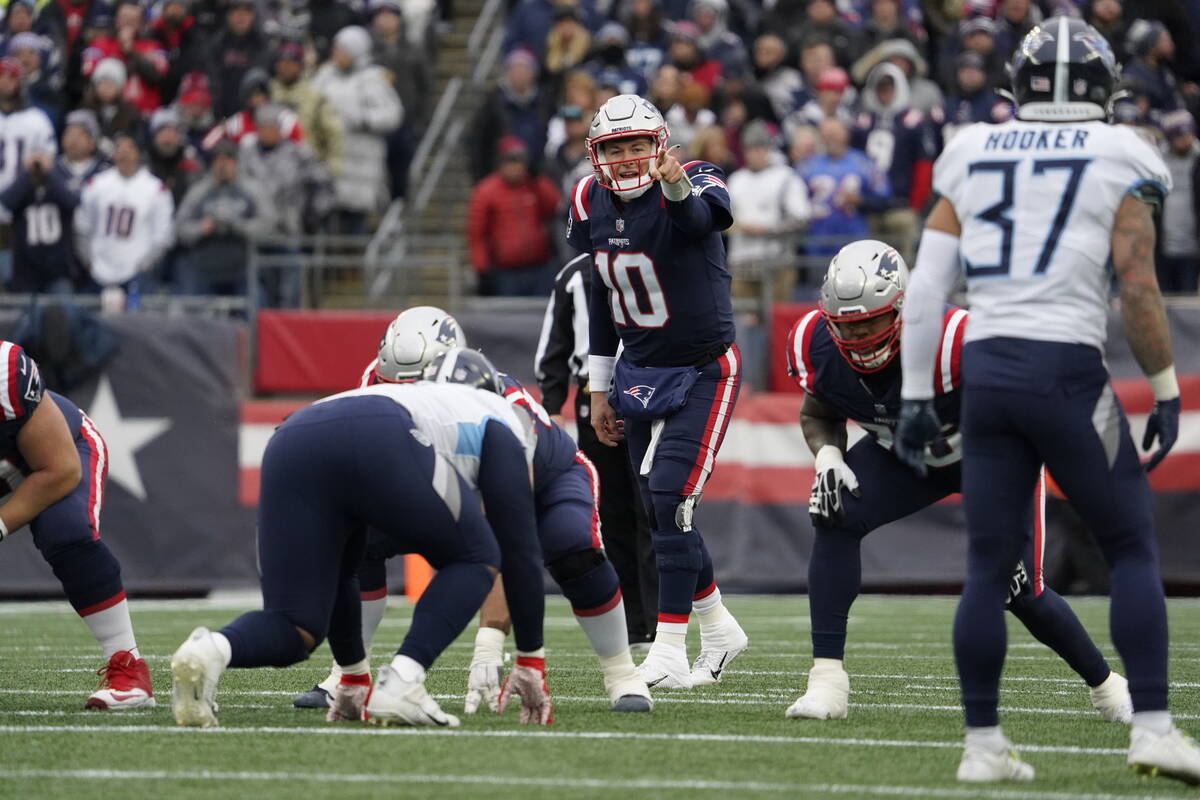 New England Patriots quarterback Mac Jones (10) during the first half of an NFL football game, ...