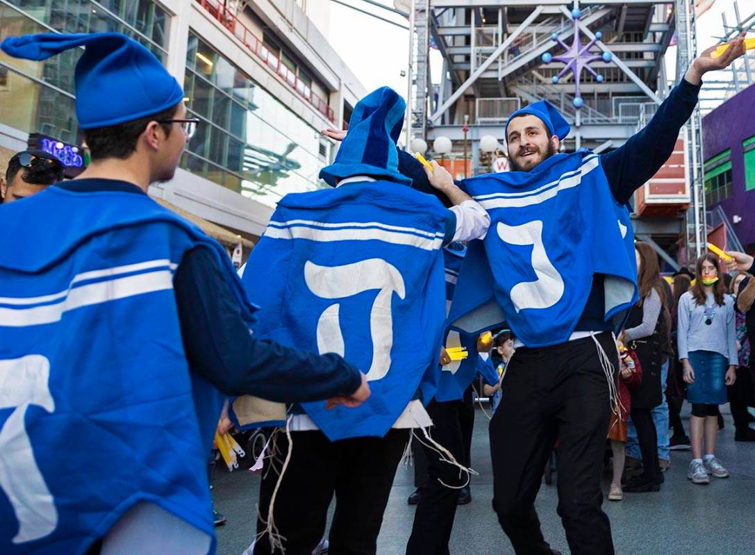 The Dancing Dreidels entertain the crowd during an event celebrating the first night of Hanukka ...