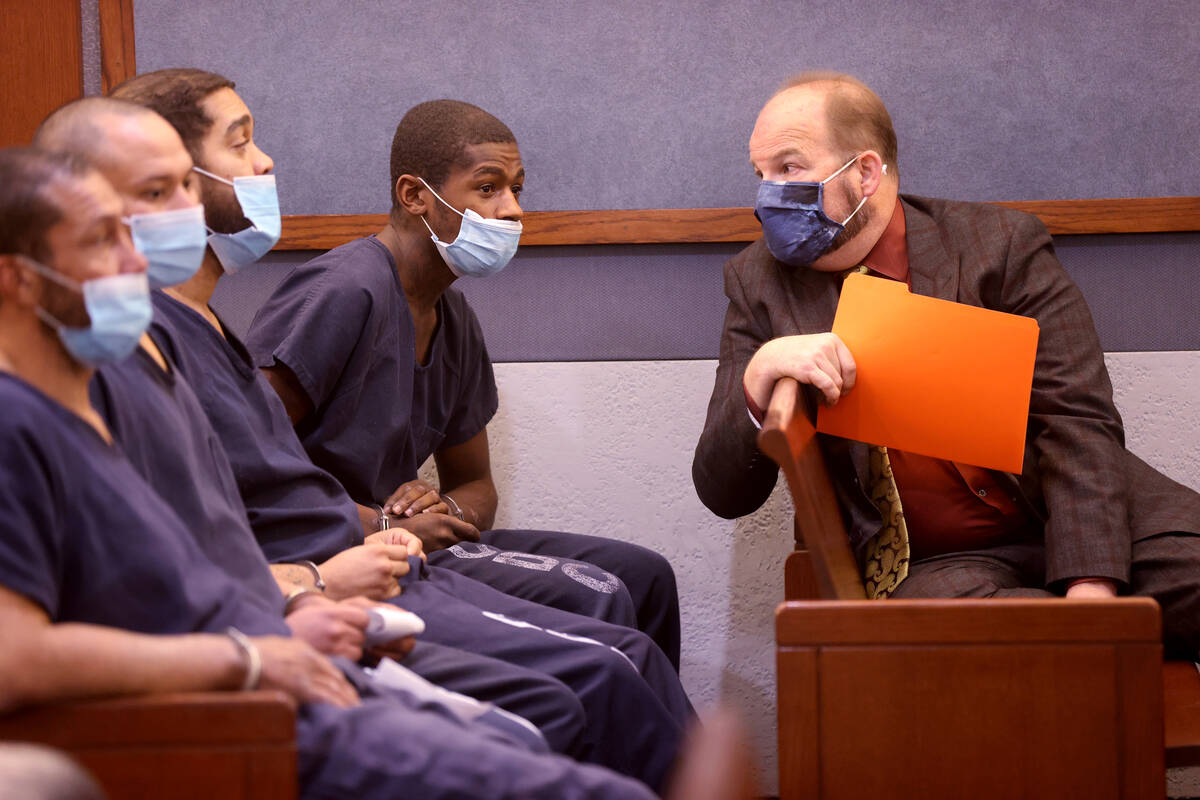 James Vaughn, 26, second from right, talks to his attorney Kenneth Frizzell in court at the Reg ...