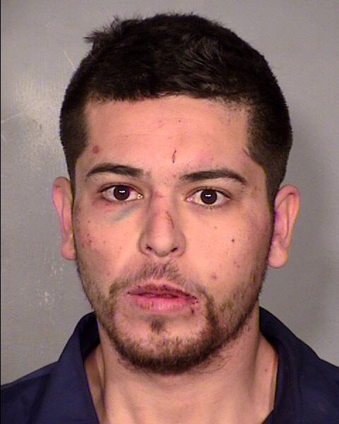 Mug shot of Brian Rodriguez after his arrest on robbery charges. The officer who arrested him w ...
