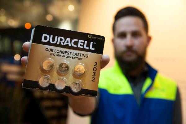 Jeremy Walters, Republic Services community relations manager, shows a pack of lithium batterie ...