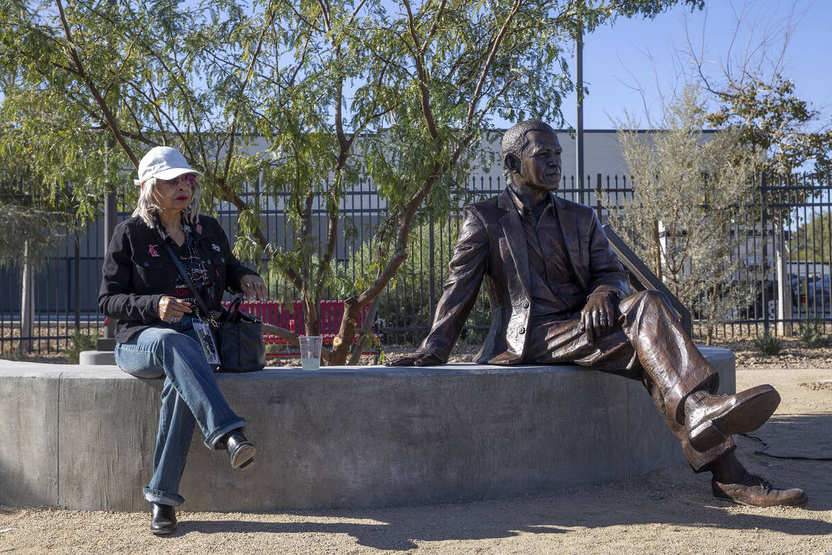 Damnette Mitchell sits next to a statue of former President Barack Obama at the new Historic We ...