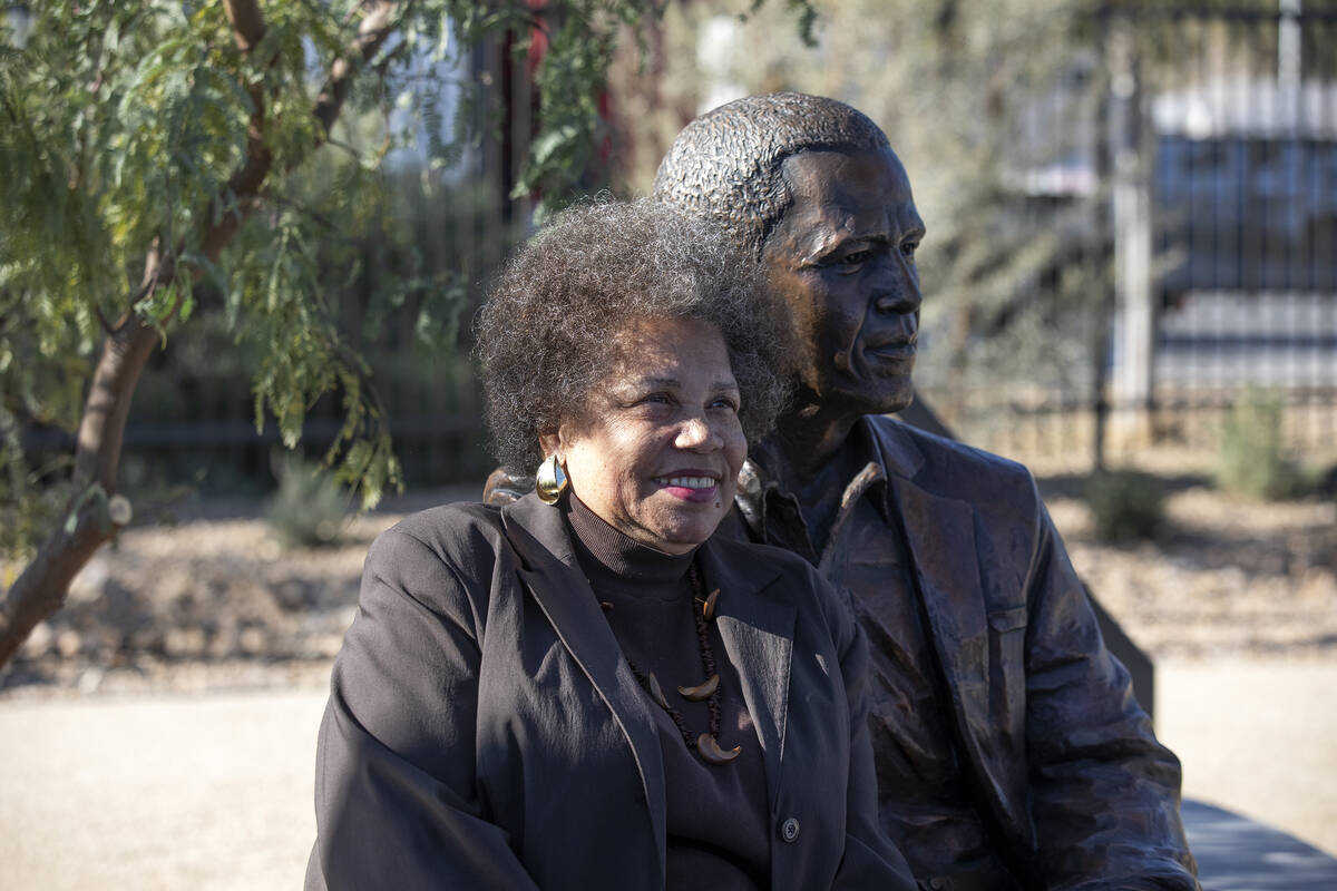 Jackie Brantley, a Westside civic activist, poses for a photo with a statue of Barack Obama at ...