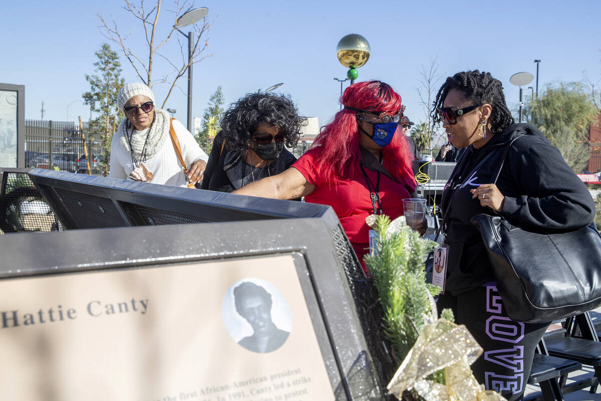 Bonnie Greathouse, second from right, and Kristi De Leon, right, view a tribute to Historic Wes ...