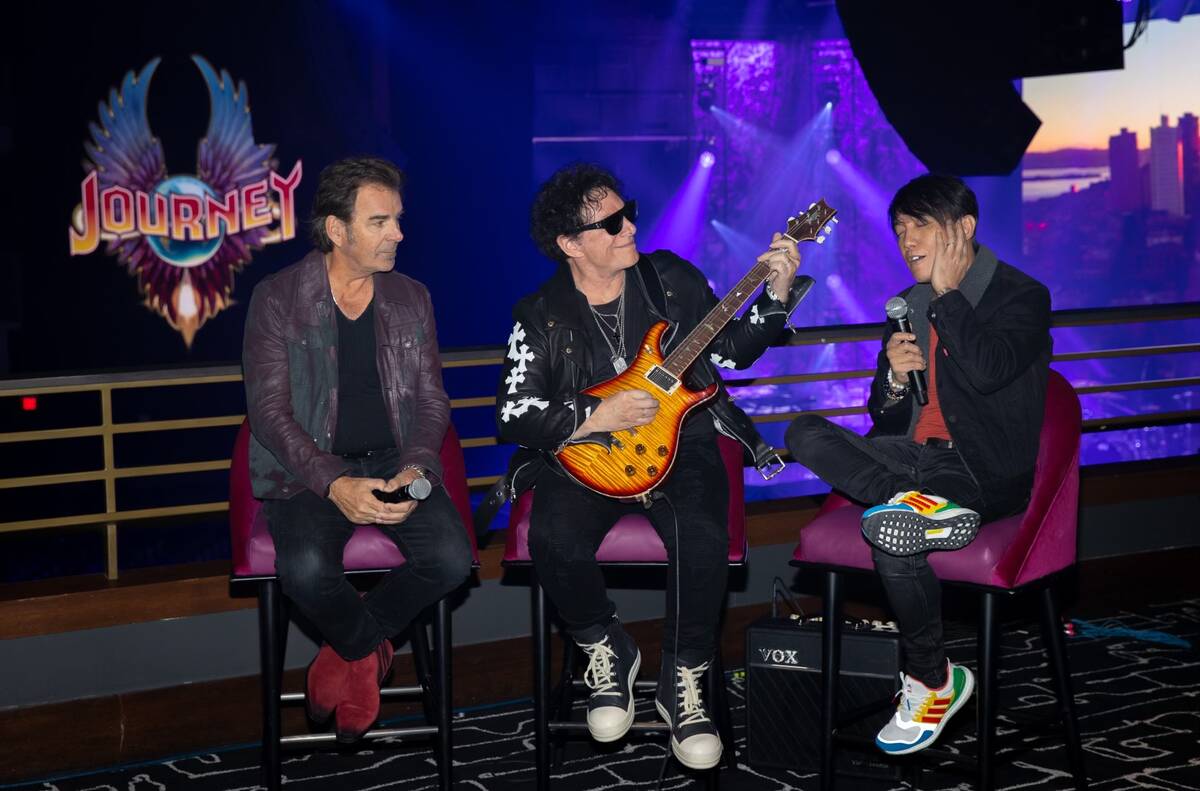 Members of the superstar rock band Journey, from left, Jonathan Cain, Neal Schon and Arnel Pine ...