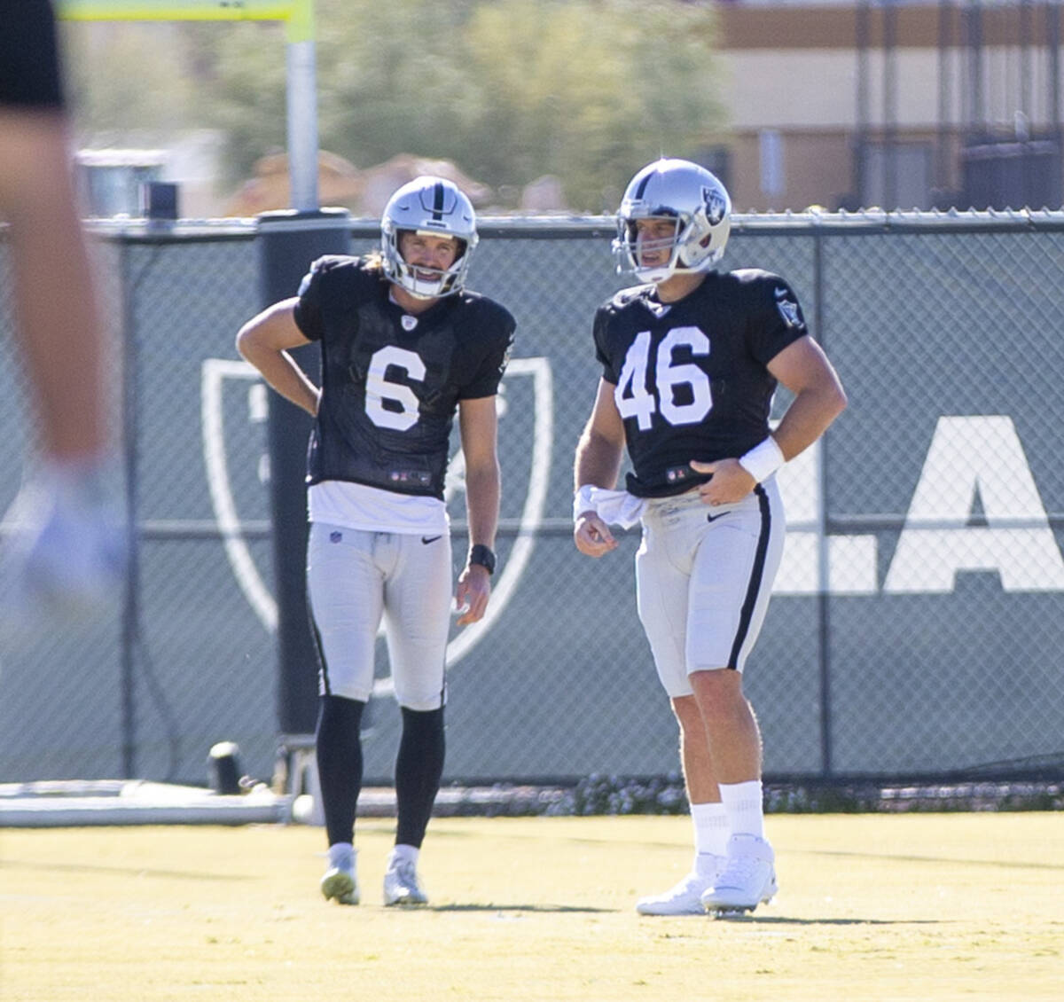 Raiders long snapper Carson Tinker (46) works with Raiders punter A.J. Cole (6) during practice ...