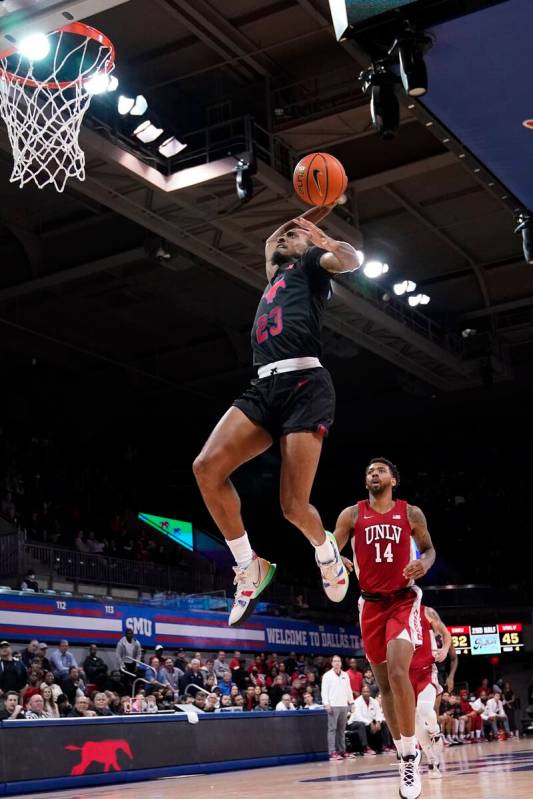 SMU guard Michael Weathers (23) goes up to dunk after getting past UNLV forward Royce Hamm Jr. ...