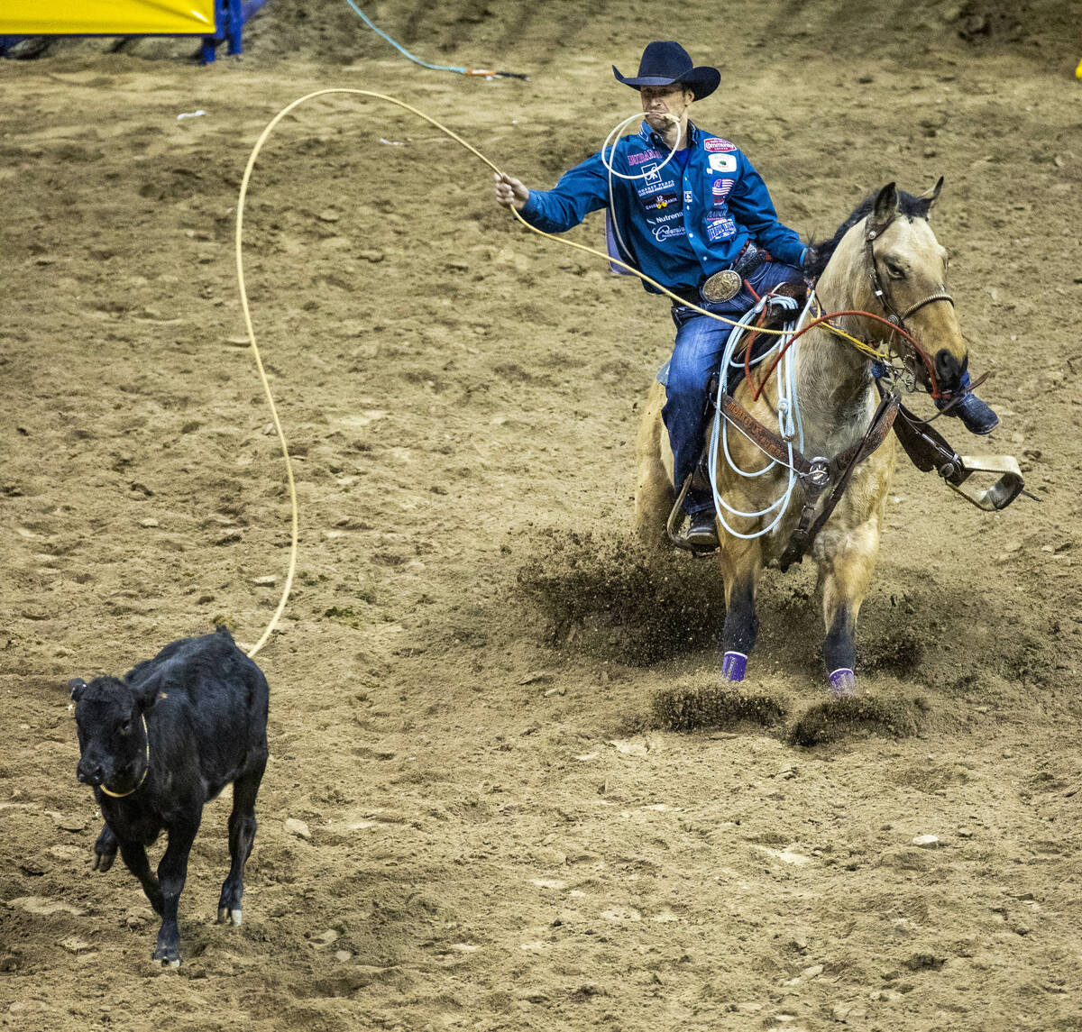 Shane Hanchey of Sulphur, LA., readies to mount his horse in Tie-Down Roping for the win during ...