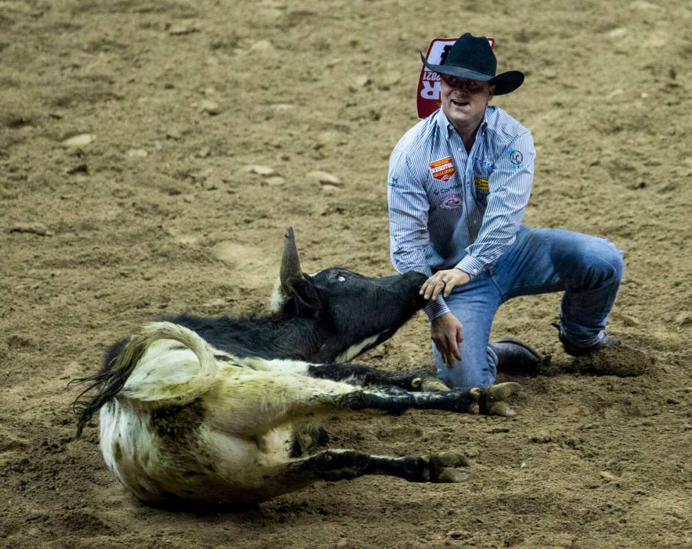 Tristan Martin of Sulphur, LA., is pleased after downing his animal in Steer Wrestling for firs ...